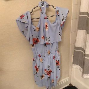 Light blue romper with flowers.